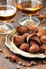 Composition with  chocolates truffles  and brandy glass