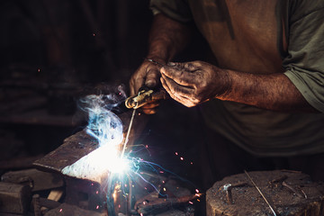 Man Working In The Blacksmith