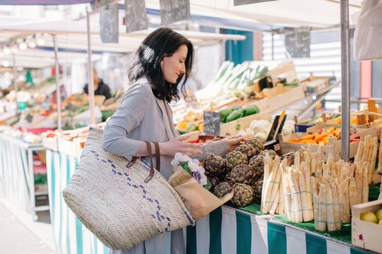 Brunette woman shopping at street market