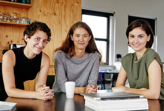 Portrait of three confident female colleagues.