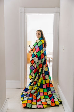 Beautiful Teen Girl Wrapped in Colorful Vintage Blanket