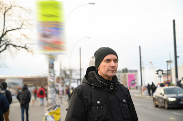 Thoughtful man looking at something. Blurred background.