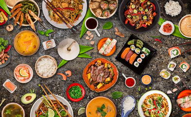 Asian food background with various ingredients on rustic stone background , top view. Vietnam or Thai cuisine.
