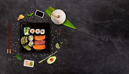 Top shot of Japanese sushi on black concrete background