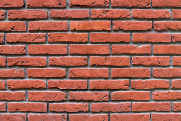 Obraz premium Weathered stained red old brick wall background, bright texture. Copy space