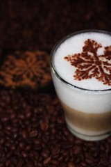 Christmas cappuccino with cinnamon and coffee beans