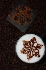 Christmas cappuccino with cinnamon and coffee beans