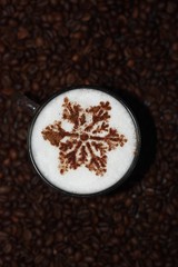 Christmas cappuccino with cinnamon and coffee beans