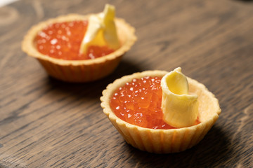 Fototapeta na wymiar red caviar and butter on tartlet