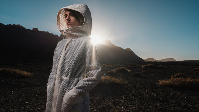 Woman Wearing Futuristic White Coat Outdoors