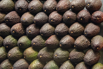 Wall of stacked avocado pears