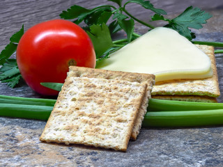 Light, wholesome breakfast with cheese, vegetables and crackers.