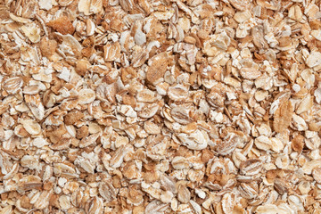Oat-flakes texture. Healthy food, green food and proper nutrition concept. Top view, flat lay, copy space