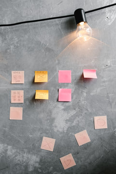 Sticky notes on concrete wall