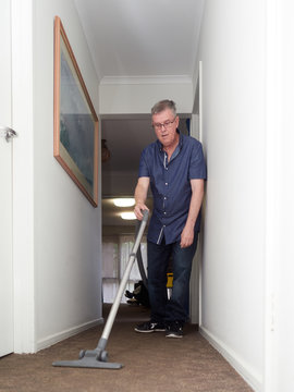 Man doing some Vacuuming
