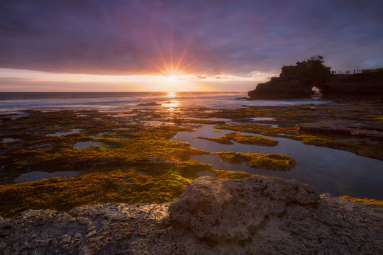 Silhouette Pura Batu Bolong Temple , Tanah Lot in sunset background, Bali, Indonesia