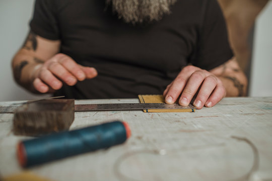 Man Working At Manufacture Of Craft Leather Products