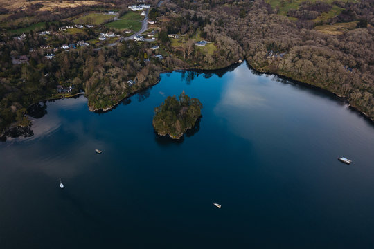 Aerial view of bay with small island and boats