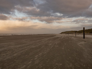 Norderney, Germany. 7 December 2019. Sandy beach on the North Sea coast on a windy winter afternoon...
