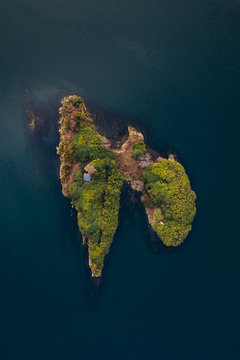 Aerial view of a little green island in a shape of lungs