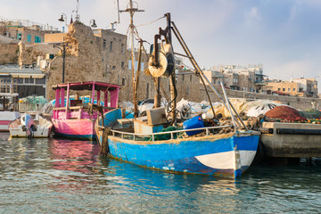 Fototapeta na wymiar Port of Akko (Acre) with boats, mosque and the old city in the background, Israel.