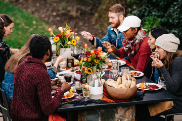 Group of friends enjoy fall dinner party