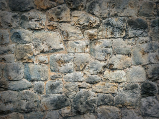 Stone wall texture with vignette, close up
