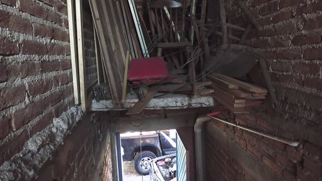 Attic furniture storage with brick walls. 4k