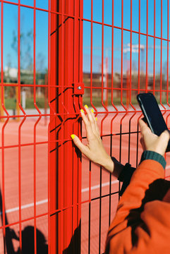 Young woman takes a photo of her manicure