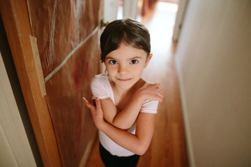 Little girl practices ballet in her room
