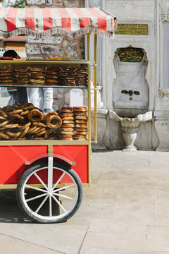 Trolley with fresh bakery on street. Turkish bagel. Simit.
