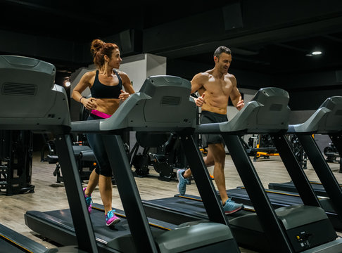 Middle-aged couplel in the gym