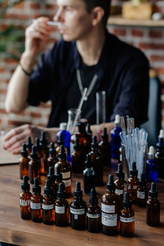 Professional man preparing perfume