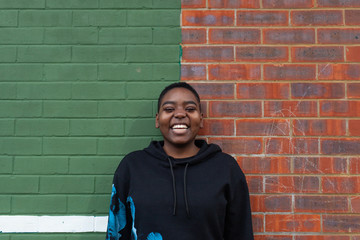 Laughing androgynous teenager.