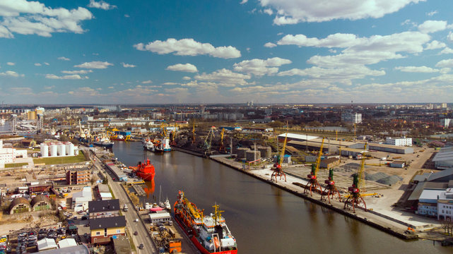 Canal with ships in industrial city