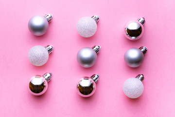 Christmas background. Xmas balls isolated on pink. Bubble pattern decoration. Flat lay. Winter concept