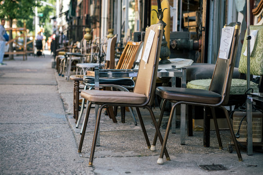 Street View of Commercial Street in Williamsburg Brooklyn with Old Chair of Junk Shop on Sidewalk