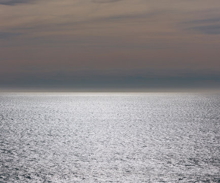 View of vast ocean and sky at dusk