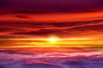 Beautiful sunset .  Beautiful heavenly landscape with the sun in the clouds . View of clouds from high altitude . Paradise heaven .light about the sky     . Sky background . 
