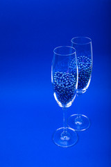 Two champagne glasses.