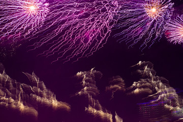 Patterns from the fireworks in the night sky.