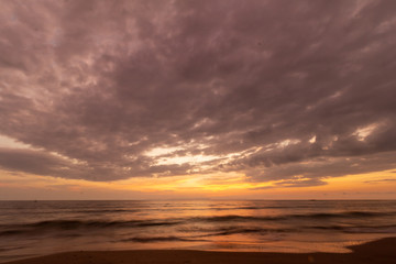 Fototapeta premium Beautiful sunset at seascape. Beach area in front of Ban Ta Nuak School Khlong Yai Subdistrict, Khlong Yai District, Hong Kong, Trat, Thailand 23110