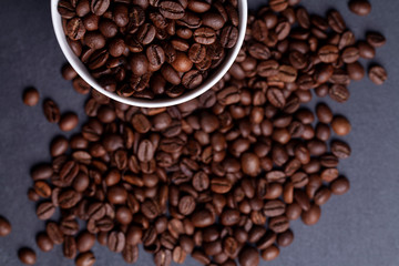 Roasted coffee beans on granite background