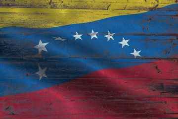 Venezuela flag on an old wooden plank forming a background