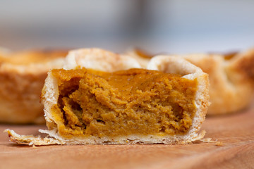 Mini pumpkin pie tart cut in half