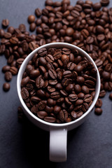Roasted coffee beans on granite background