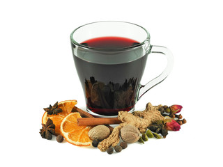 Mulled wine in glass cup with spices for making hot wine drink - dried orange slices, ginger,...