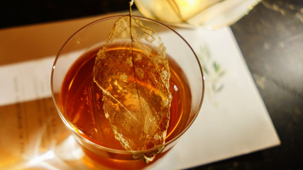 Multicolored cocktails at the bar. Party cocktails and longdrinks with ice garnished with fruits.