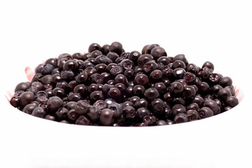 Background full to the brim of fruits of the blueberries. Fresh food in macro.