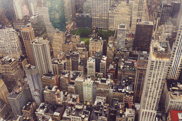 Fototapeta na wymiar Top view of New York skyline in rainy and cloudy day. Skyscrapers of NYC in the fog